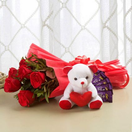 10 red roses,6''teady,2 dairymlk silk